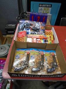 Assortment of toys & cap guns. As shown.