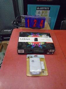 Linksys wifi router. Appears sealed in box with remote doorbell. As shown.
