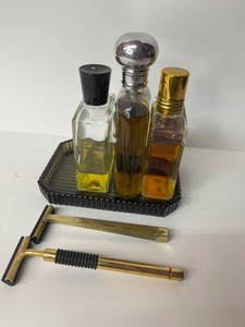 lot 58 image: Lot of Vintage gold razors, cologne, aftershave, and glass tray