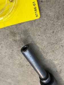 lot 76 image: Remington powder actuated tool with hard DeWalt case, and misc. fasteners