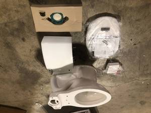 American Standard  Champion Tall Height 2-Piece High-Efficiency 1.28 GPF Single Flush Elongated Toilet in White Seat Included, customer returns, review all pictures