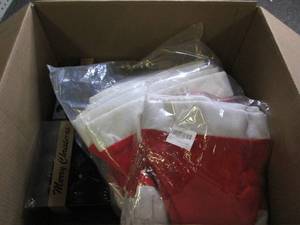 box of christmas bulbs and santa ha...