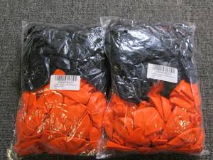 2 packages of orange and black ball...