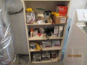 lot 34 image: Shelf filled with hardware paint an...
