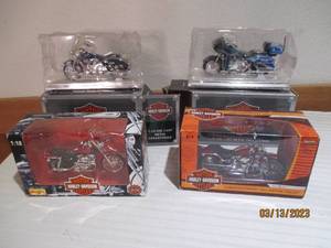lot 60 image: 4 Die cast Harley Davidson replicas...