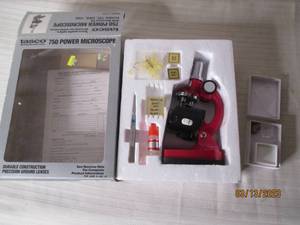 lot 66 image: Tasco 750 power microscope...