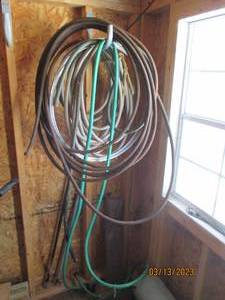 lot 127 image: Garden hoses and wire...