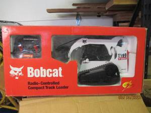 lot 143 image: Radio controlled Bobcat loader toy...