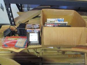lot 150 image: VHS tapes and vehicle electronics...
