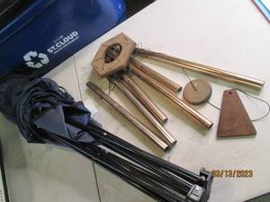lot 179 image: Folding camp chair and wind chime...