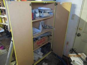 lot 296 image: Cabinet full of garage items...