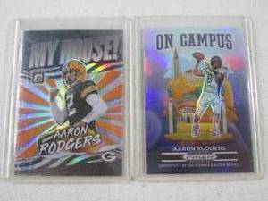 lot 146 image: 2021 Aaron Rodgers Prizm & Optic In...