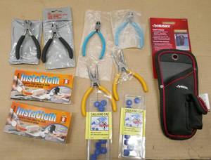 lot 81 image: Tool lot - snips,needle nose pliers, caulk caps, knife pouch
