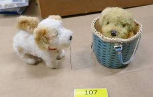 lot 107 image: 2 vintage wind-up toys - dog rises up and spins around and other one twirls his tail