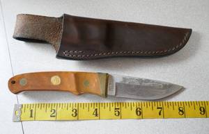 lot 177 image: Schrade fixed blade knife with leather sheath