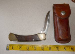 lot 195 image: Schrade L87 pocket knife with leather sheath