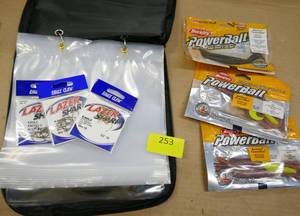 lot 253 image: Soft sided bait bag with 9 pages in it, some hooks, 3 diff size, and powerbaits
