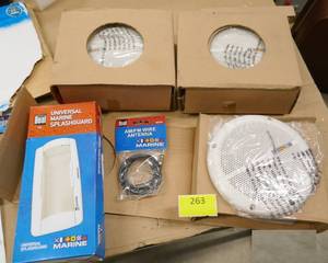 lot 263 image: 3 New marine speakers and splashguard cover for radio, by Dual Electronics