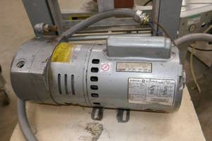 lot 318 image: Gast Vacuum pump with GE 12hp motor 1ph