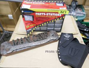 lot 327 image: Parts bins, holster for power tools, and Man Cave sign