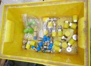 lot 332 image: Yellow parts bin with Cajon Swagelok connectors