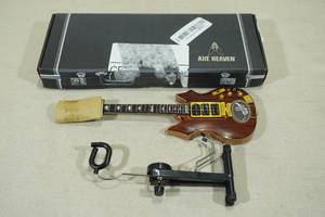 lot 212 image: Axe Heaven Jerry Garcia Tiger Mini Guitar