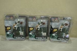 lot 227 image: 3 Tim Tebow Action Figures