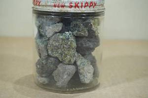 lot 258 image: Jar of Olivine Green Crystal Stones