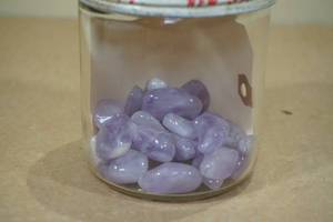 lot 260 image: Jar of Polished Amethyst Stones