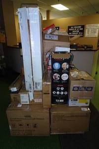 lot 178 image: Pallet of Damaged Items - Portable Washers, Microwaves, Cookware, Health and Beauty, Electronics
