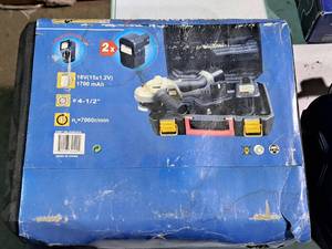 lot 795 image: 4-12 Angle Grinder (in original packaging) with (2) Batteries, Charger, Case
