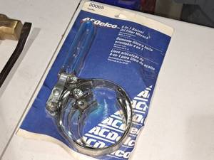 lot 867 image: AC Delco 4-in-1 Swivel Oil Filter Wrench 30065 (in original packaging)