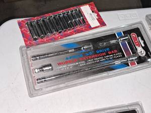 lot 944 image: Lot of (2) Hand Tools (in original packaging) - Grip 4-pc 38 Drive Wobble Extension Bar Set, 14 Drive 11-pc 18-916 Deep Socket Set HM1411D