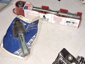 lot 946 image: Lot of (2) Hand Tools (in original packaging) - AC Delco Belt Type Oil Filter Wrench, Boxer 4-pc 38 Drive Tune-Up Kit