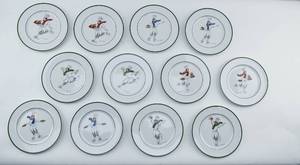 lot 45 image: Guy Buffet Skating Chefs Fine Porcelain Plates - Set of 12