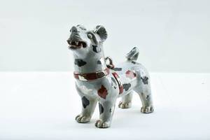 lot 53 image: Vintage Porcelain Dog Sculpture