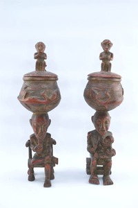 lot 7 image: Pair Tall Red Painted Primitive Wood Carving Lidded Vessels