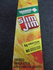 lot 292 image: Box of 24-0.97 oz Slim Jims Tabasco...