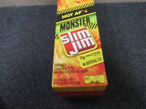 lot 296 image: Box of 18 - 1.94 oz Slim Jim Monste...