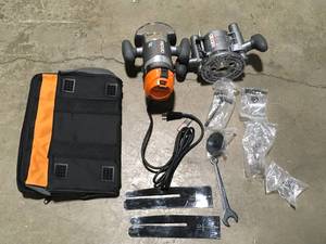 lot 27 image: RIDGID  11 Amp 2 HP 12 in. Heavy-Duty Fixed and Plunge Base Corded Router Customer returns, Review all pictures
