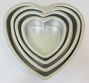 lot 89 image: New Fat Daddios Heart Shaped Baking Pans and Utensils