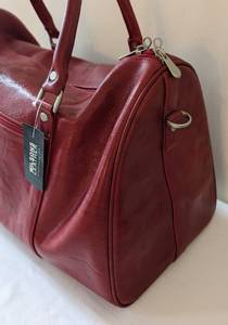 lot 37 image: New Wilsons Red Leather Weekender Bag