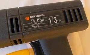 lot 306 image: Black and Decker 38 Inch 13 HP Variable Speed Drill with Drill Bits