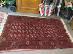 lot 82 image: Large and heavy dark tone area rug ...