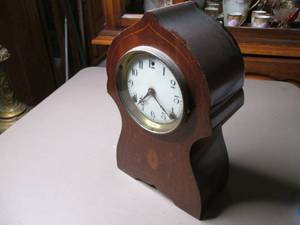 lot 94 image: Wood encased mantle clock...
