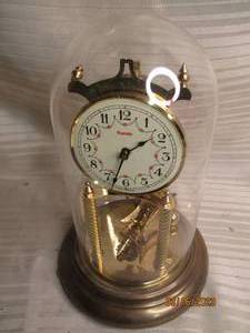 lot 228 image: Glass covered Kundo brass clock mad...