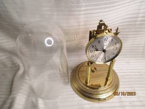 lot 230 image: Lchatz plastic covered brass clock ...