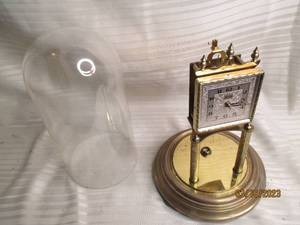 lot 231 image: (1) Schatz glass covered brass cloc...