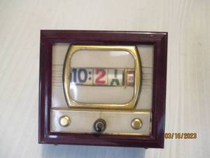 lot 255 image: Television branded and shaped clock...