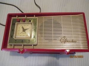 lot 259 image: Red Sylvania box style clock...